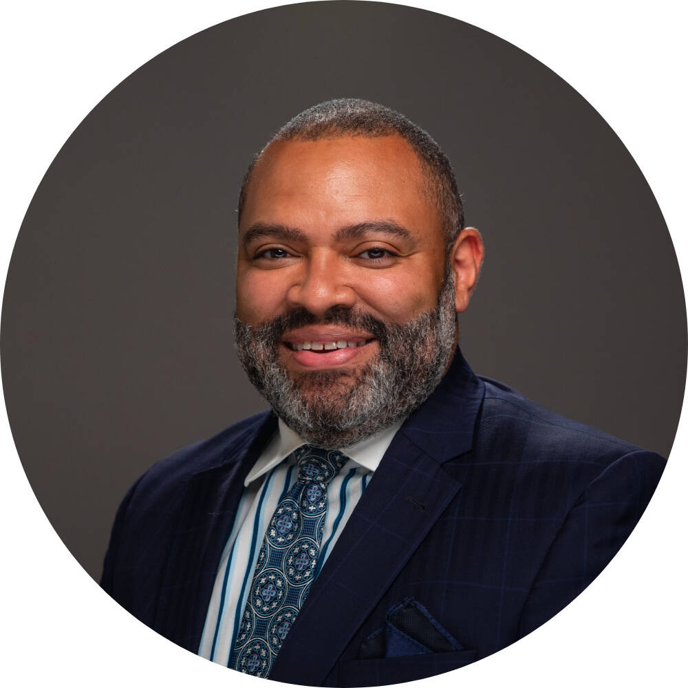 H. Julian Woods smiling for his GVSU headshot.